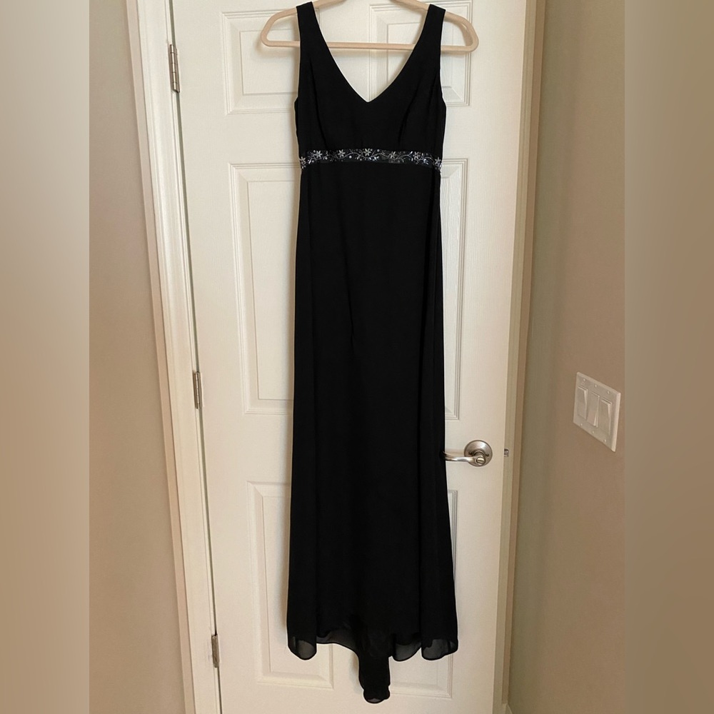 Full length black dress with slight train.  See through band under chest
